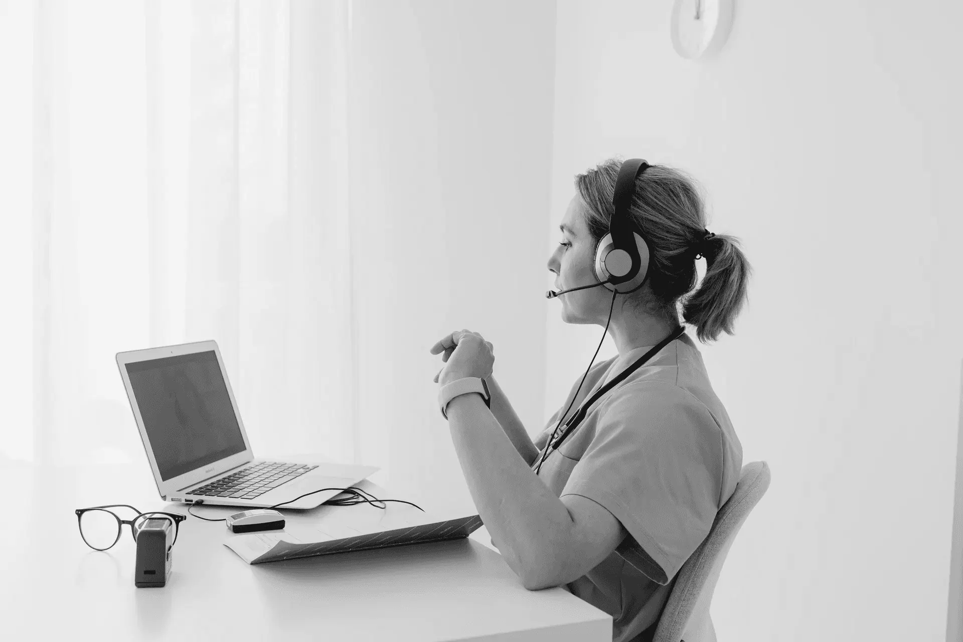 A medical secretary attending a videoconference
